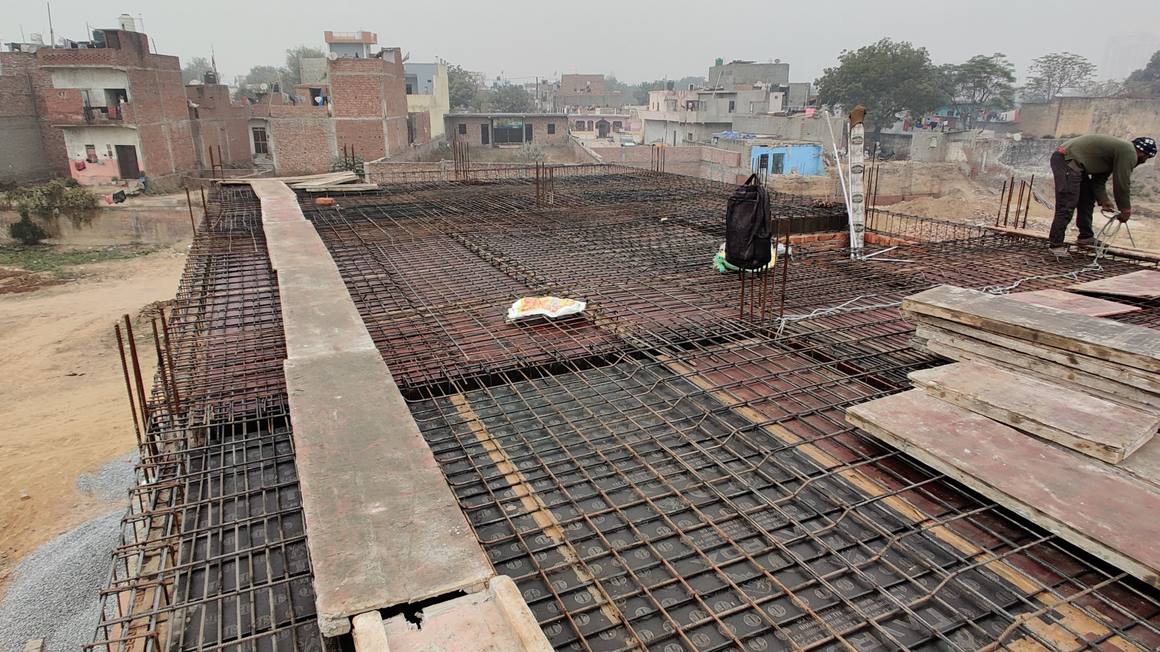Slab reinforcement tied and checked before the pour at the Shauryapuram house, Ghaziabad.